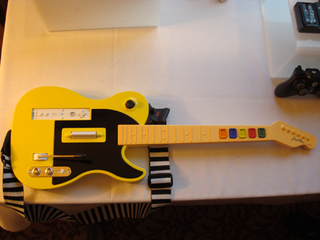 Illustration for article titled Nyko Gaming Goodness: Guitar Hero / Rock Band Guitar, Wireless Nunchuck, PS3 Rumble and More